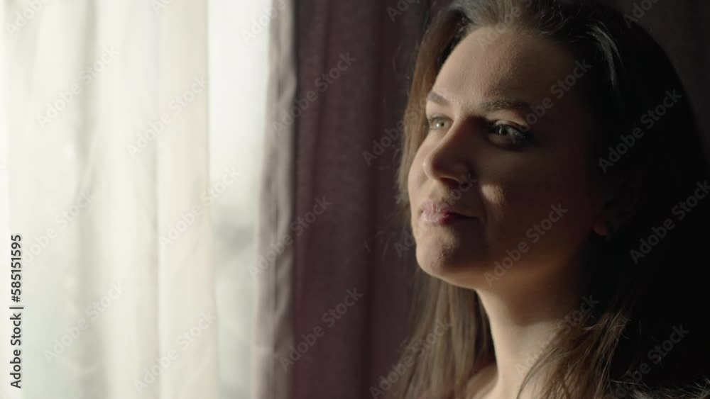 Close-up of a girl drinking morning coffee by the window. The beginning of a new day. Happy woman. High quality 4k footage Close-up of a girl drinking morning coffee by the window. The beginning of a new day. Happy woman. High quality 4k footage