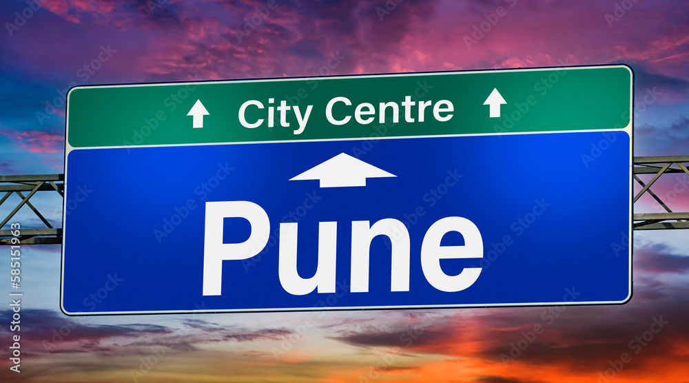 Road sign indicating direction to the city of Pune