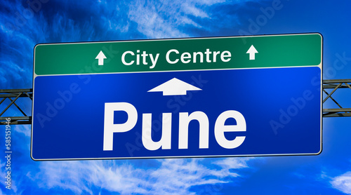 Road sign indicating direction to the city of Pune