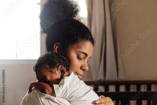 Mother holding a newborn.