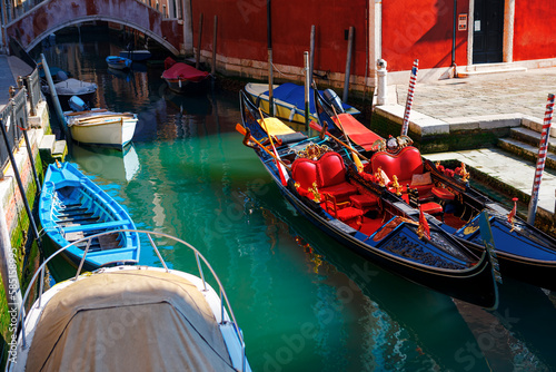 Traditional gondola on water canal in Venice . Famous boats of Venezia