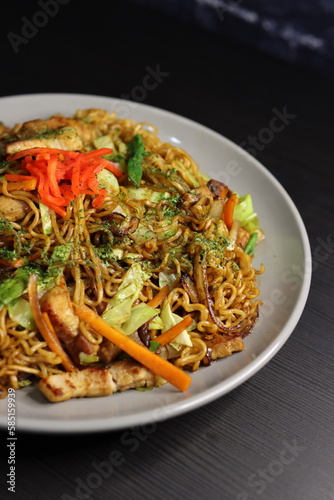 Japanese Yakisoba Instant Stir Fry Noodles with Cabbage, Pork Belly, Carrots, Ginger, Seaweed, Green Onions - Closeup