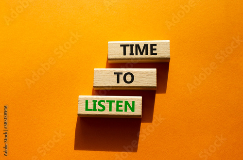 Time to listen symbol. Wooden blocks with words Time to listen. Beautiful orange background. Business and Active listening concept. Copy space.