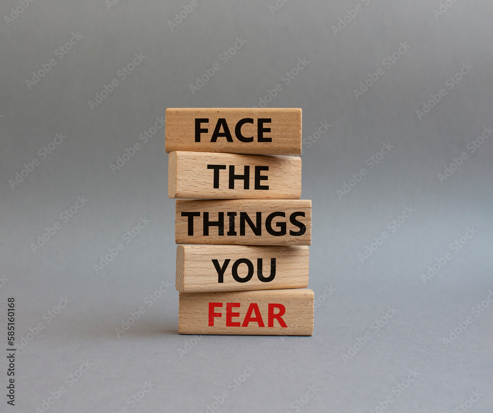 Face the things you fear symbol. Wooden blocks with words Face the things you fear. Beautiful grey background. Business and Face the things you fear concept. Copy space. Face the things you fear symbol. Wooden blocks with words Face the things you fear. Beautiful grey background. Business and Face the things you fear concept. Copy space.