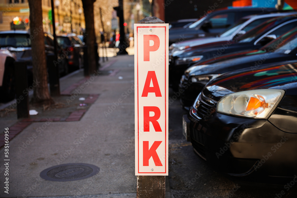 A green and white square sign with 