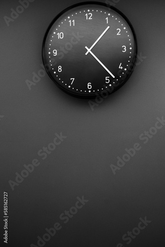 Analog black clock on a wall
