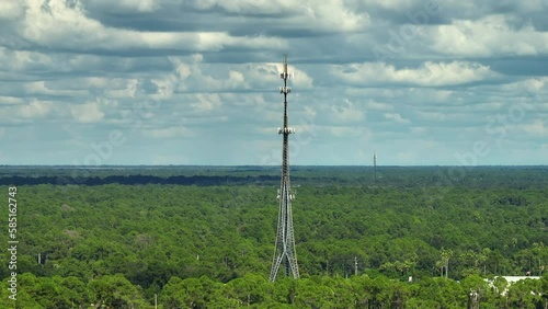 Aerial view of telecommunications cell phone tower with wireless communication 5g antennas for network signal transmission