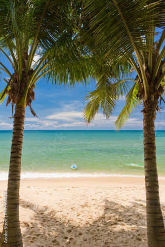 Sand beach with palms and canoes in Phu Quoc close to Duong Dong, Vietnam