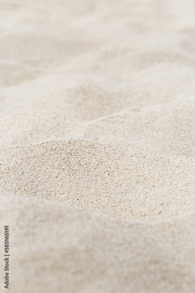 Beige Sand texture natural background. Close up waves pattern on sand dunes, minimal nature vertical backdrop, view beach. Summer and travel, spa and relaxation concept. Selective focus. Beige Sand texture natural background. Close up waves pattern on sand dunes, minimal nature vertical backdrop, view beach. Summer and travel, spa and relaxation concept. Selective focus.