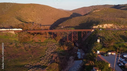 2023 - Excellent aerial footage of an Amtrak train crossing a railroad bridge in Lompoc, California.