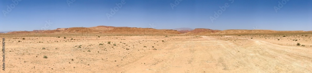 Panorama view of the hot dry moroccan desert in the midday sun Panorama view of the hot dry moroccan desert in the midday sun
