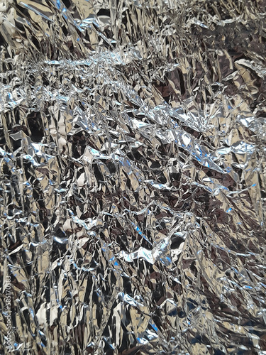 Crumpled aluminum foil. Wrinkled silver surface