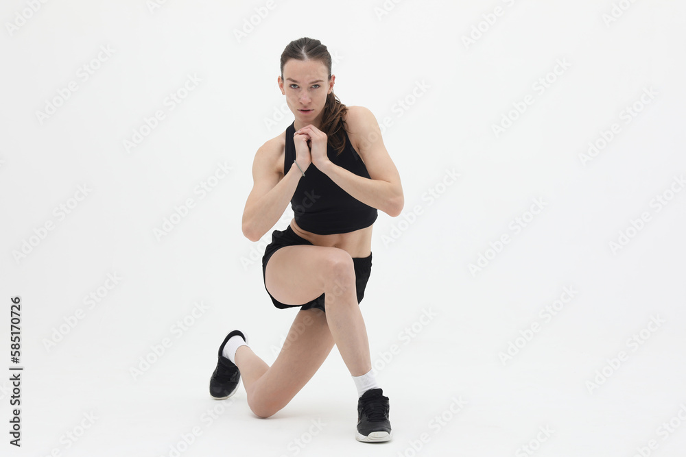 young athletic woman doing lunge exercise isolated on white background, front view