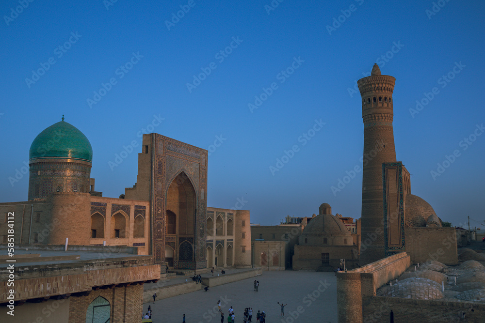 Sunet with panoramic view and Persian architecture in the ancient silk road city of Bukhara, Uzbekistan, Po-i-Kalan Islamic religious complex, , Kalyan mosque and Bukhara Tower