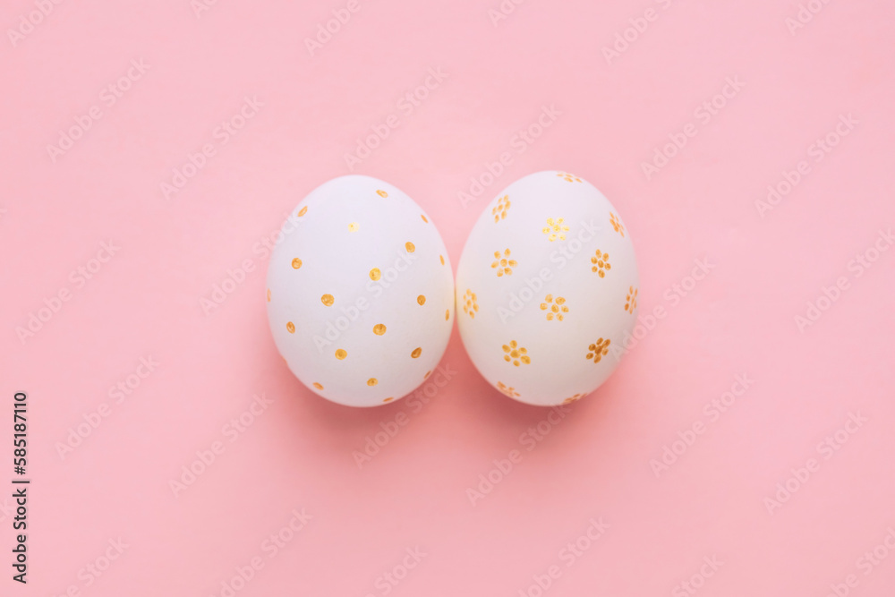 Easter handmade golden decorated eggs on pink background. Minimal easter concept. Flat Lay of Golden Easter Egg