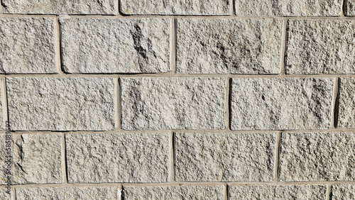 The wall is made of decorative rectangular gray stone. Stone background