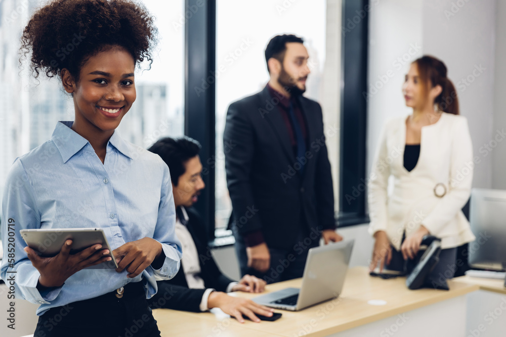 Call center business woman talking on headset. Call center worker accompanied by her team. Customer service executive working at office. Call center business woman talking on headset. Call center worker accompanied by her team. Customer service executive working at office.