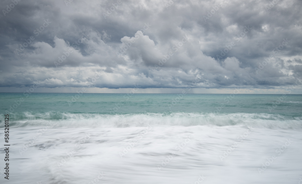 Fototapeta premium Windy waves crashing on a coast on a stormy day in winter.