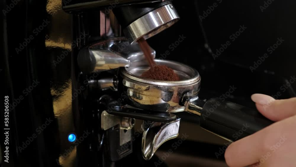 Close up video of barista grinding coffee beans. Close up video of barista grinding coffee beans.
