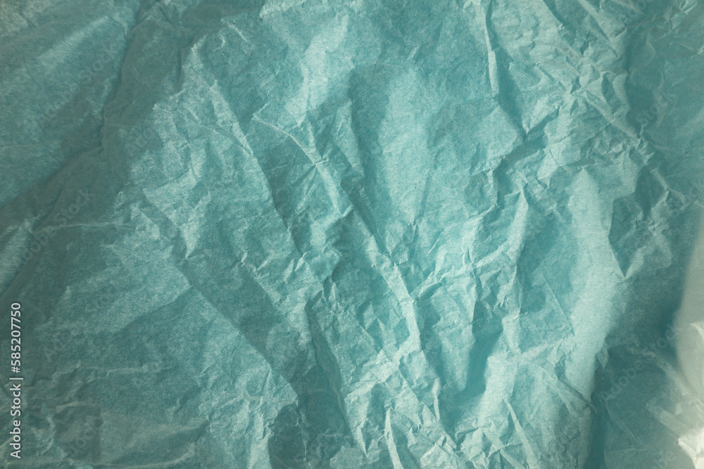 Fototapeta premium Light blue crumpled paper texture background