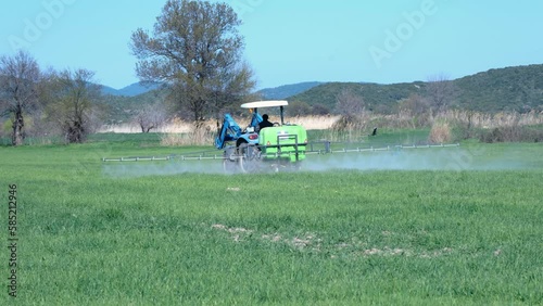 field spraying with tractor photo