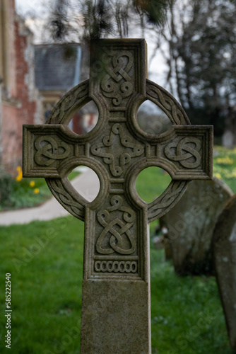 celtic cross in cemetery at the evening