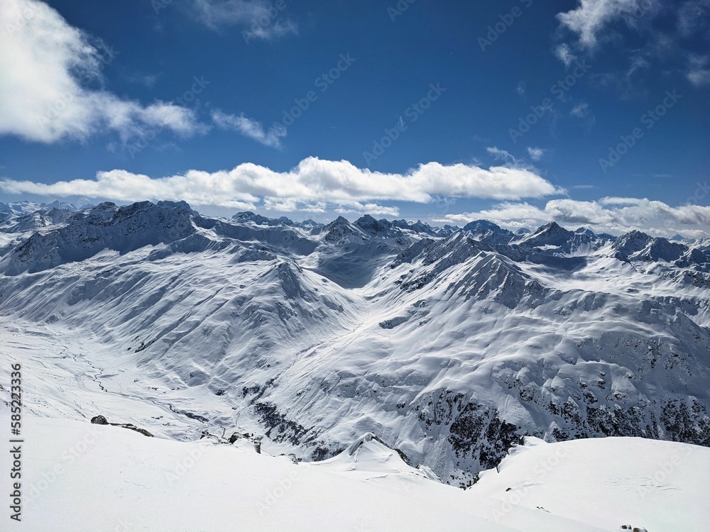 fantastic mountain panorama above Davos Klosters Graubünden, Switzerland. great view of the snowy mountains. Summit Sentisch Horn. ski mountaineering. High quality photo
