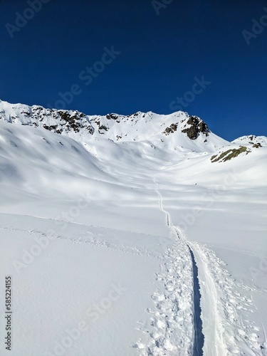 beautiful ski tour in the swiss mountains. Super mountain weather for a long ski tour. High quality photo photo