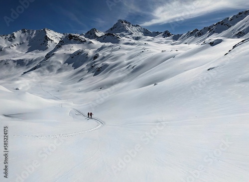 Beautiful Moutain Panorama.  ski tour through the wonderful mountain world in Davos. View of the Flüela Wisshorn and the Jöriseen. Ski mountaineering in winter wonderland. High quality photo