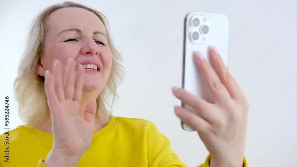 Friendly smiling millennial businesswoman in wireless headphones with microphone waving hand making hello gesture starting online meeting web camera video call conversation with colleagues Friendly smiling millennial businesswoman in wireless headphones with microphone waving hand making hello gesture starting online meeting web camera video call conversation with colleagues