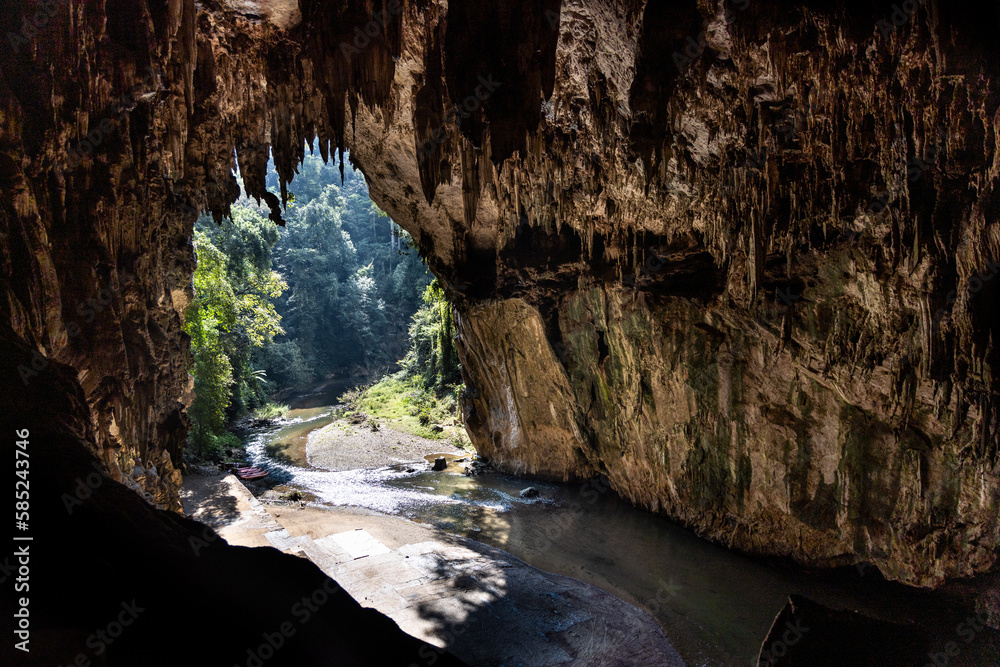 The scenic chamber with river in the Tham Nam Lod cave, popular tourist attraction in Mae Hong Son, Thailand