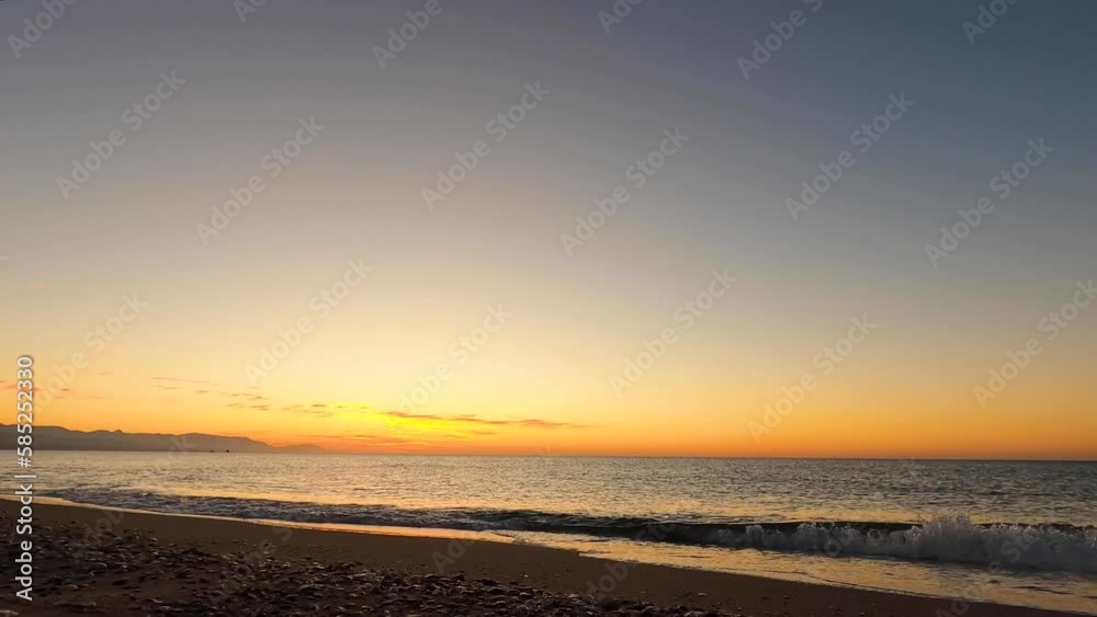 Bright orange sunrise over Mediterranean Sea. Morning sky for meditation. Calm seascape. Costa del Sol, Malaga, Spain. Time lapse series. Bright orange sunrise over Mediterranean Sea. Morning sky for meditation. Calm seascape. Costa del Sol, Malaga, Spain. Time lapse series.