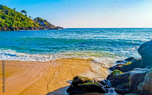 Beach sand blue water huge surfer waves Carrizalillo Puerto Escondido. photo