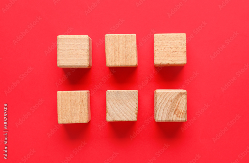 Wooden cubes with check marks on red background Wooden cubes with check marks on red background