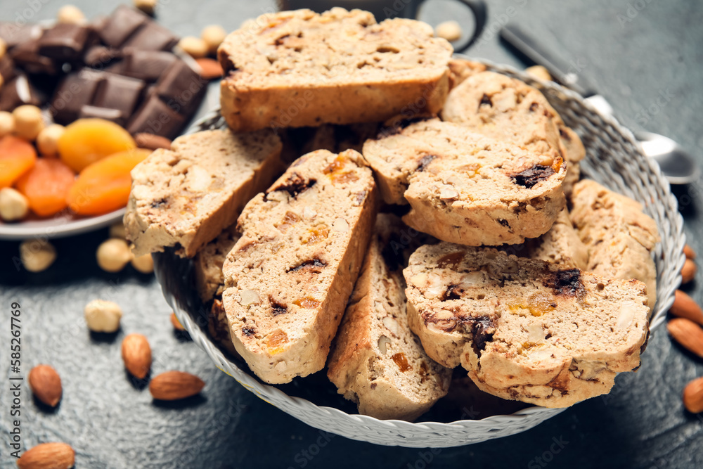 Bowl with delicious biscotti cookies on grunge background Bowl with delicious biscotti cookies on grunge background