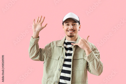 Cool young man showing "cal...