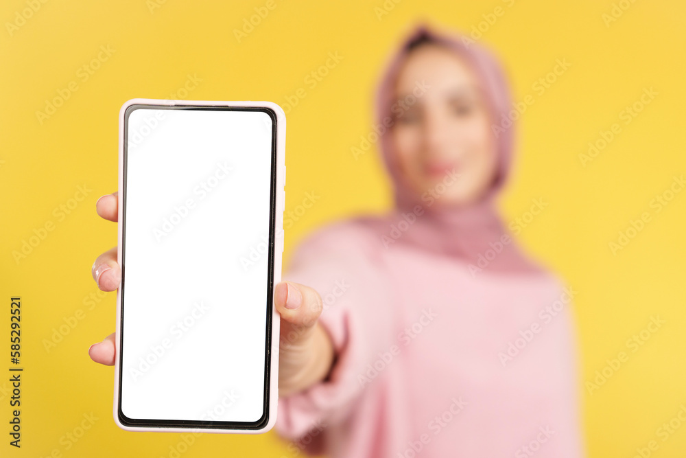 Blank screen of the mobile held by a muslim woman
