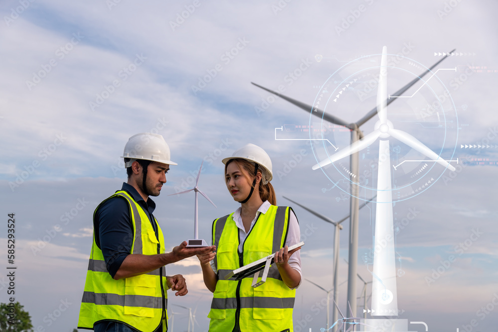 Double exposure architecture engineer working at windmill farm with infographic show power technology alternative eco environment friendly sustainable renewable energy resource industry concept.