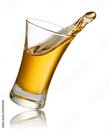 gold tequila shot with splash isolated on white