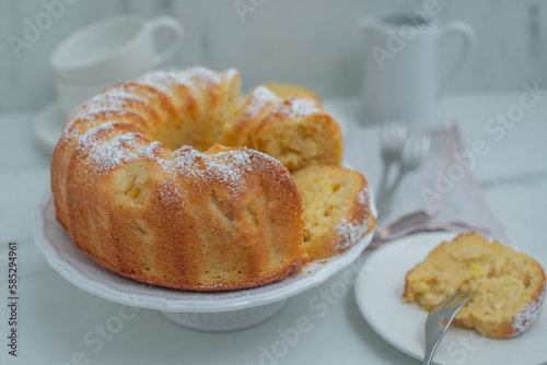 Lemon bundt cake drizzled with powdered sugar glaze