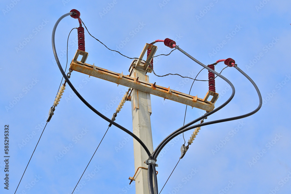 Connecting a cable to an overhead power line on a spring day Connecting a cable to an overhead power line on a spring day