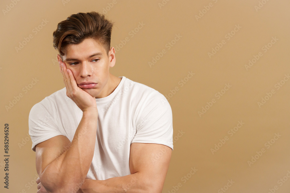 Bored caucasian man with the hand on the face Bored caucasian man with the hand on the face