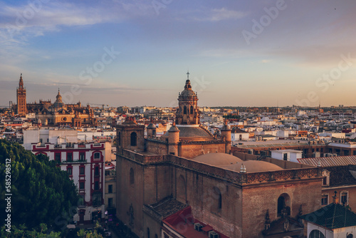 Colorful sunset over Seville with the Seville Cathedral and the Giralda tower in the background, taken from Metropol Parasol, Seville, Andalusia, Spain
