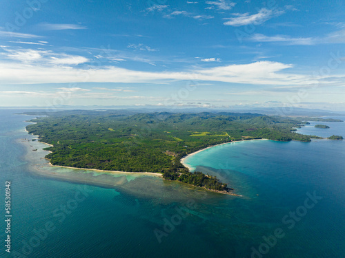 View from the sea to the island of Borneo with rainforest and mountains. The Tip of Borneo, Malaysia.