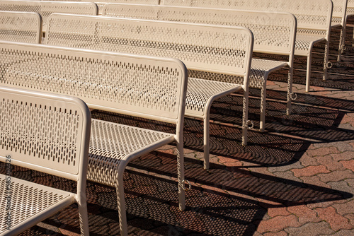 Fotografering Metal benches and their shadows