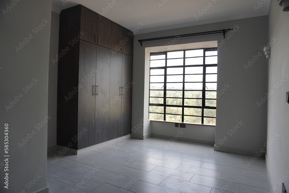 Fototapeta premium empty room with door and wardrobes bedroom