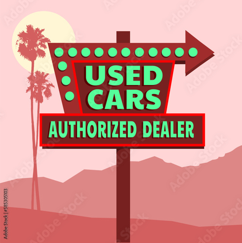 Retro neon used cars sign with palm trees in distance 