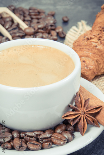 Fototapeta Naklejka Na Ścianę i Meble -  Cup of coffee and fresh croissant with chocolate for breakfast
