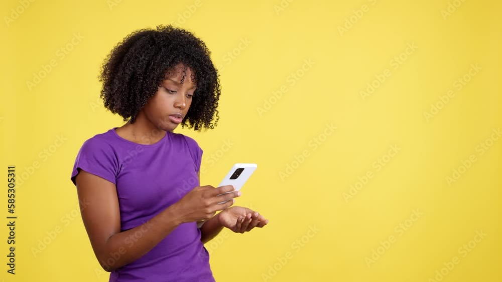 Angry african woman looking at the mobile Angry african woman looking at the mobile