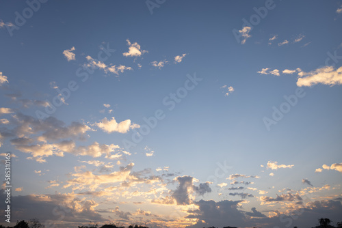 Beautiful sky and cloud at high. Include space, light of nature, sunset, sunrise. Colorful with yellow, orange and blue color at evening time in autumn for scene, backdrop, background and wallpaper. 